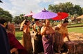 October 20 2020, old style Thai tradition dress up ladies walking to the temple in historical temple landmark