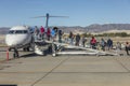 October 4, 2016 - Passengers climbing stairs to board airplane, Santa Barbara, CA