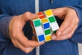 Rubik`s cube in female hands - game for solving problems Royalty Free Stock Photo