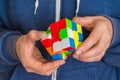 Rubik`s cube in female hands - game for solving problems Royalty Free Stock Photo