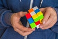Rubik`s cube in female hands - game for solving problems Royalty Free Stock Photo