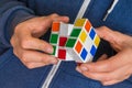 Rubik`s cube in female hands - game for solving problems Royalty Free Stock Photo