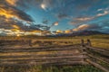 OCTOBER 3, 2018, RIDGWAY COLORADO USA - Sunrise on worm western fence in front of San Juan Mountains in Old West of Southwest Royalty Free Stock Photo