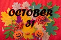 October 31st is the date for Halloween. Pumpkin shape with a scary smile Halloween on a colorful autumn background