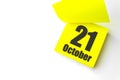 October 21st . Day 21 of month, Calendar date. Close-Up Blank Yellow paper reminder sticky note on White Background. Autumn month