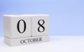 October 08st. Day 8 of month, daily calendar on white table with reflection, with light blue background. Autumn time, empty space Royalty Free Stock Photo