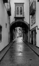 A Street walking in the Streets of Guimares, UNESCO World Heritage, chasing light and shadows, Guimares, Portugal. Royalty Free Stock Photo