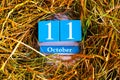 October 11th. Blue cube calendar with month and date