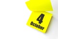 October 4th. Day 4 of month, Calendar date. Close-Up Blank Yellow paper reminder sticky note on White Background. Autumn month, Royalty Free Stock Photo