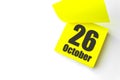October 26th. Day 26 of month, Calendar date. Close-Up Blank Yellow paper reminder sticky note on White Background. Autumn month,