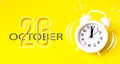 October 26th. Day 26 of month, Calendar date. White alarm clock with calendar day on yellow background. Minimalistic concept of