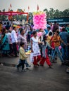 October 19th 2022, Dehradun, Uttarakhand, India. An Indian mother taking her kids to a festival fair