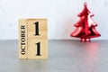 October 11th. Hello October, Cube wooden calendar showing date on 11 October.