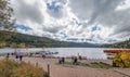 Tourists enjoy the view of Titisee during autumnal day.