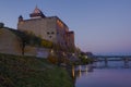 October twilight at the foot of the medieval castle of Hermann. Narva Royalty Free Stock Photo