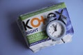 October 1, 2022 Ukraine city of Kyiv hygiene modern  products from tht company Kotex, alarm clock Royalty Free Stock Photo