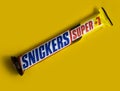 October 13, 2022 Ukraine city Kyiv Snickers energy chocolate on a colored background