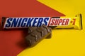 October 13, 2022 Ukraine city Kyiv Snickers nutritious chocolate on a colored background