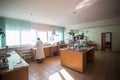 October 14, 2014.Ukraine.Kyiv. Caucasian middle-aged woman in a white coat in the chemical laboratory. A specialist at work, on