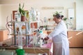 October 14, 2014.Ukraine.Kyiv. Caucasian middle-aged woman in a white coat in the chemical laboratory. A specialist at work, on