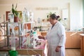 October 14, 2014.Ukraine.Kyiv. Caucasian middle-aged woman in a white coat in the chemical laboratory. A specialist at work, on