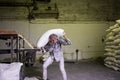 14 october 2014. Ukraine.Kyiv.The theme is a working factory. A Caucasian man carries heavy bags of finished products in an old