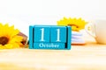 October 11 on the wooden calendar.The eleventh day of the autumn month, a calendar for the workplace.