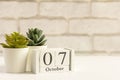 October 7 on a wooden calendar on a table or shelf.One day of the autumn month.Calendar for October. Autumn