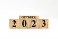 October 2023 written on wooden blocks isolated on white background with copy space Royalty Free Stock Photo