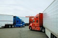 Resting place the truck stop on various types of trucks in a parking lot off the highway with gas station for refueling