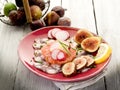 Octopus carpaccio over grapefruit Royalty Free Stock Photo