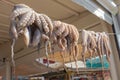 Octopus tentacles drying in the sun near a cafe in greece Royalty Free Stock Photo