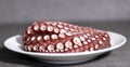 Octopus on a white plate. Royalty Free Stock Photo