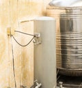 Od water storage tank and vintage water pump