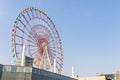 Odaiba colorful tall Palette Town Ferris wheel named Daikanransha visible from the central urban area of Tokyo in the summer blue