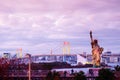 Odaiba Rainbow bridge and statue of Liberty with Tokyo bay view at night Royalty Free Stock Photo