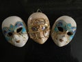 The odd one out of three Venetian masks