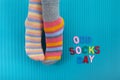 Odd Socks Day. Day lost socks, lonely socks on blue background. Royalty Free Stock Photo