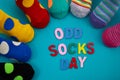 Odd Socks Day. Day lost socks, lonely socks on blue background. Royalty Free Stock Photo