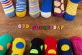 Odd Socks Day. Day lost socks, lonely socks on wooden background. Royalty Free Stock Photo