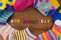 Odd Socks Day. Day lost socks, lonely socks on wooden background. Royalty Free Stock Photo