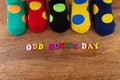 Odd Socks Day. Day lost socks, lonely socks on wooden background.