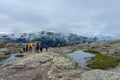 Odda, Norway, 8 August 2022: Long queue to get a photo over Trolltunga, the famous tourist spot