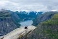 Odda, Norway, 8 August 2022: Tourists over the famous Trolltunga scenic spot