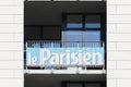 Le parisien advertising on a building