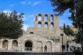 Odeon of Herodes Atticus - ruins of Roman theater by Acropolis in Athens Greece- with tourists below