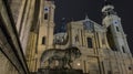 Odeonsplatz, Munich, Germany. City view at night: Theatinerkirche and the lion sculpture at the Feldherrnhalle