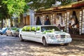 Limousine by Mercedes brand decorated for wedding near restaurants on the street of the city of Odesa, Ukraine