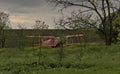 An old biplane is located near a small Bessarabian village