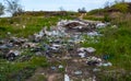 Heaps of plastic trash on the shore of the reservoir. Ecology of nature